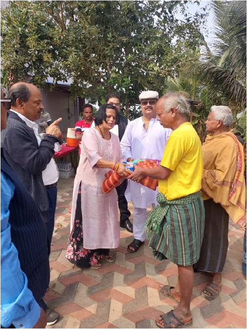 A blanket handed directly to an elderly resident of Baranga village.